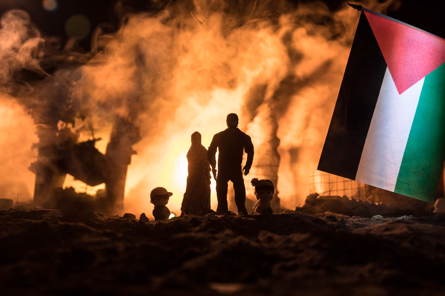 People silhouetted by fierce flames after yet another attack on Gaza