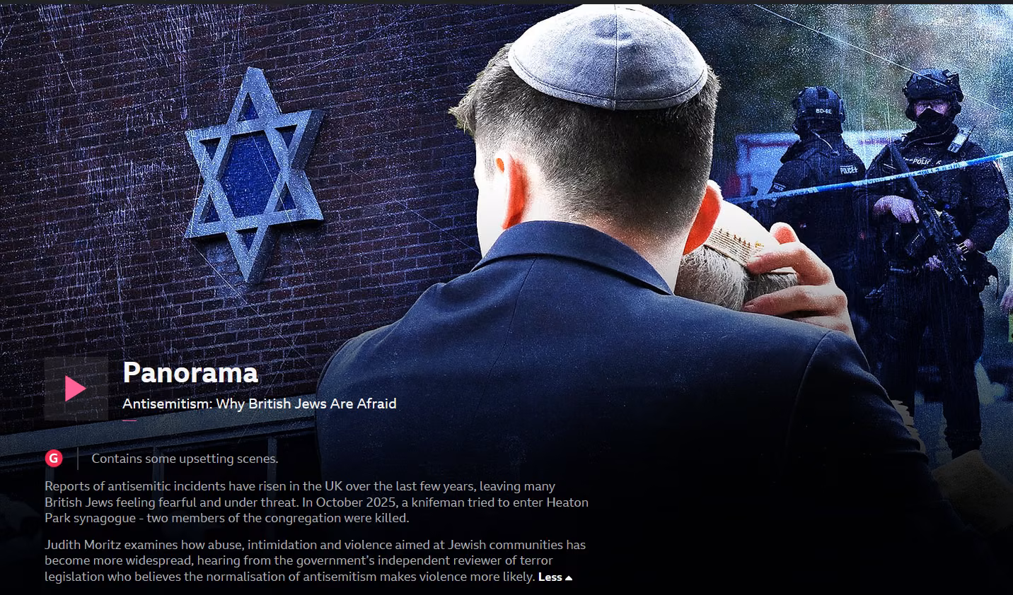 rear view of man wearing kippah, sta of david on a wall to left, armed police in right bakcground