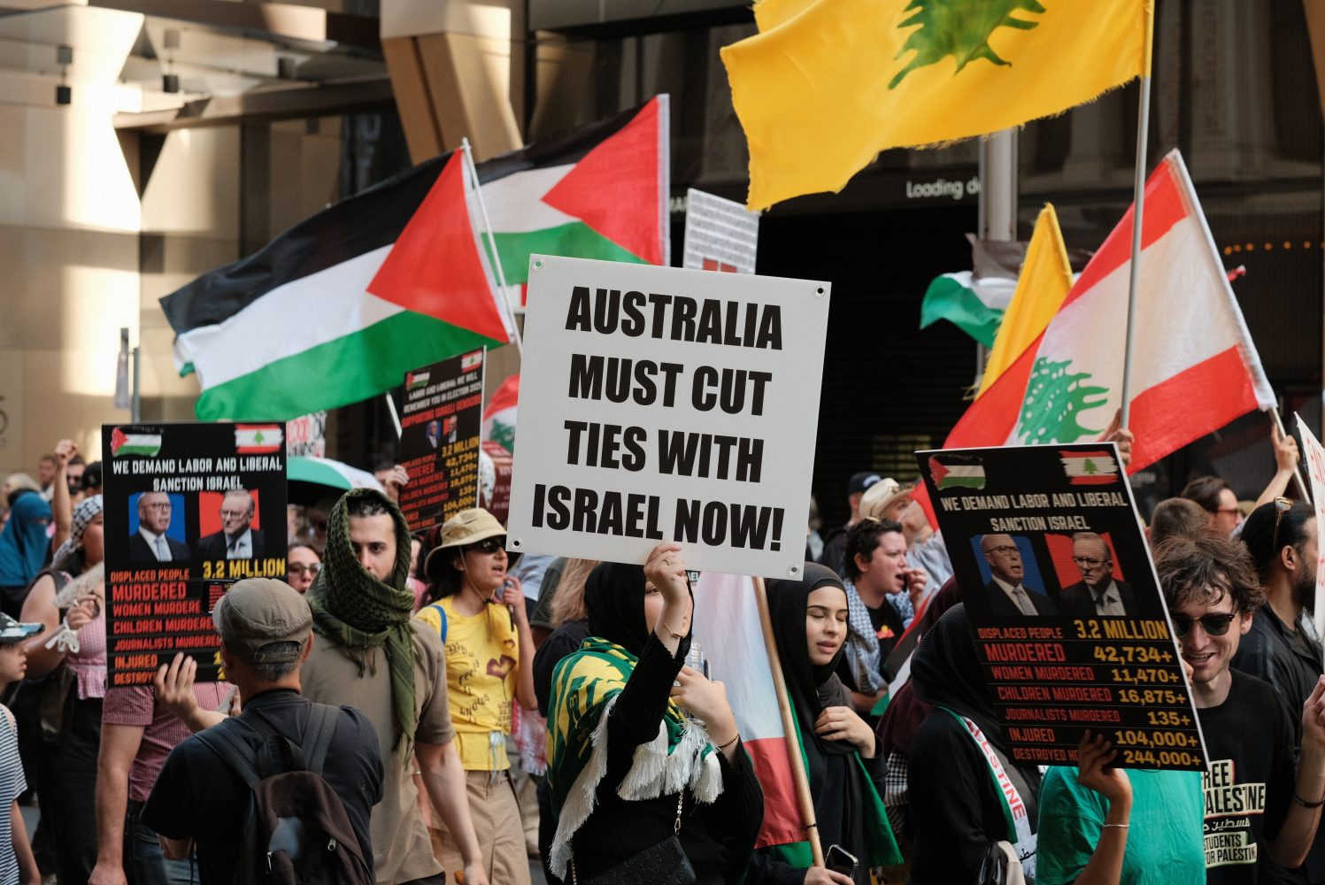 Sydney, New South Wales Australia - October 6 2024: Pro Palestine rally in Sydney Australia with sign saying Australia must cut ties with israel now If a Zionist Feels Uncomfortable